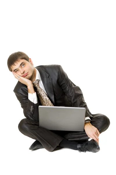 Los hombres jóvenes con su portátil con una cara aburrida aislado en blanco —  Fotos de Stock