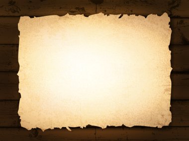 Burnt paper at wooden background