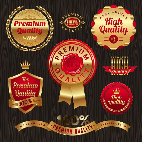 Ensemble d'étiquettes et d'emblèmes de qualité dorée — Image vectorielle