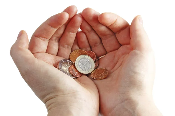 Руки з монетами євро — стокове фото