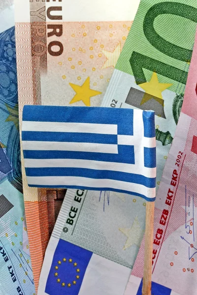 stock image Euro banknotes and Greek flag