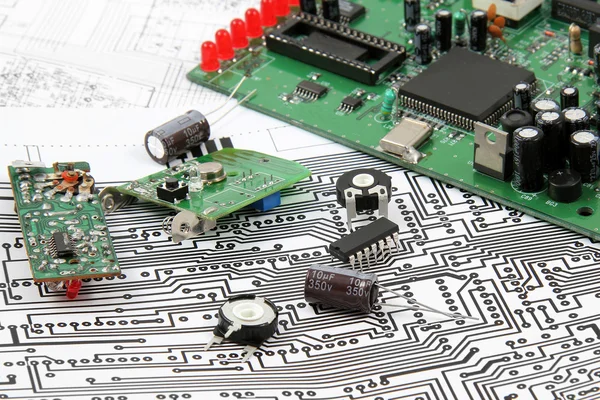 Electronic circuit boards on the background of electronic scheme — Stock Photo, Image