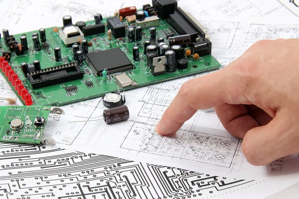 stock image Electronic circuit boards on the background of electronic scheme