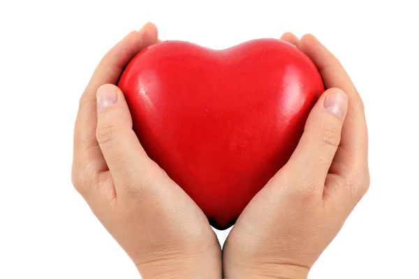 Um coração vermelho em uma mão — Fotografia de Stock