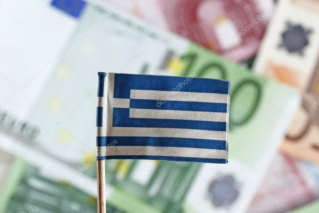 Euro banknotes and greek flag