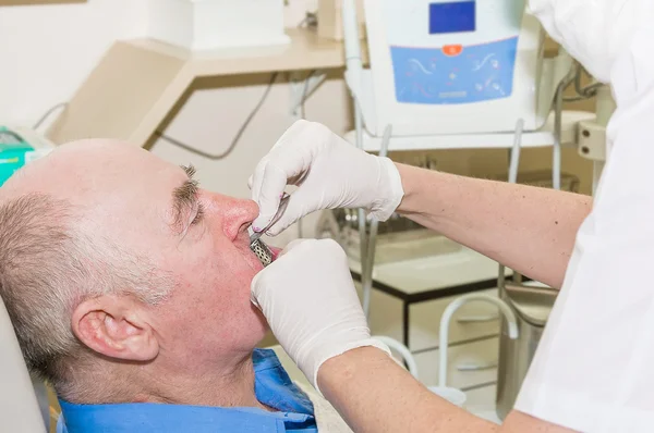 Older man in dentist — Stock Photo, Image