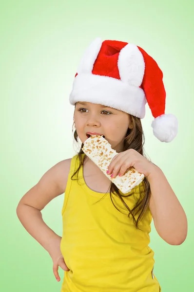 小女孩穿着红色的圣诞帽 — 图库照片