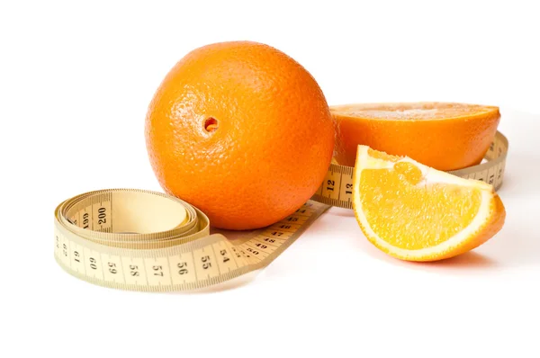 Centimetric tape and oranges — Stock Photo, Image