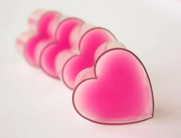 Fila desenfocada de corazones rosados — Foto de Stock