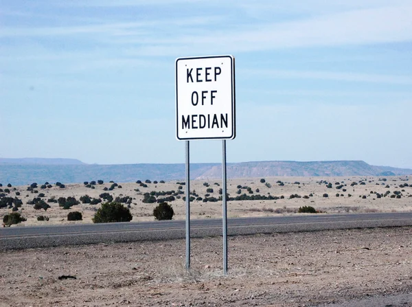 Keep off Median against a mountain landscape — Stock Photo, Image
