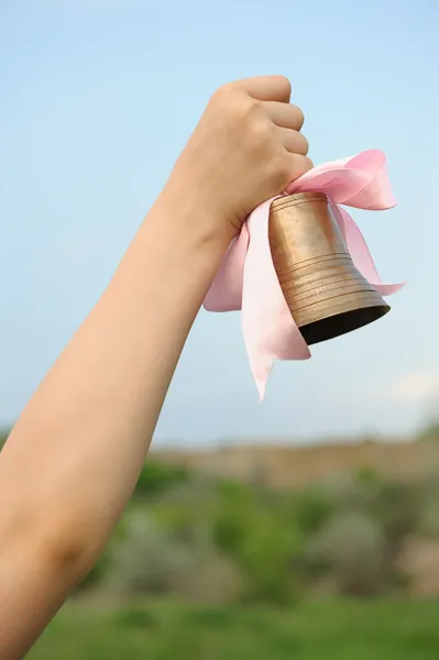 The hand with a bell — Stock Photo, Image