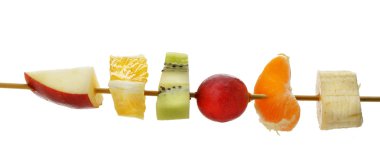 Slices of fruit on a wooden stick clipart