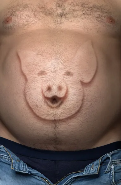 Man's stomach from a pig sticking out by the image — Stock Photo, Image