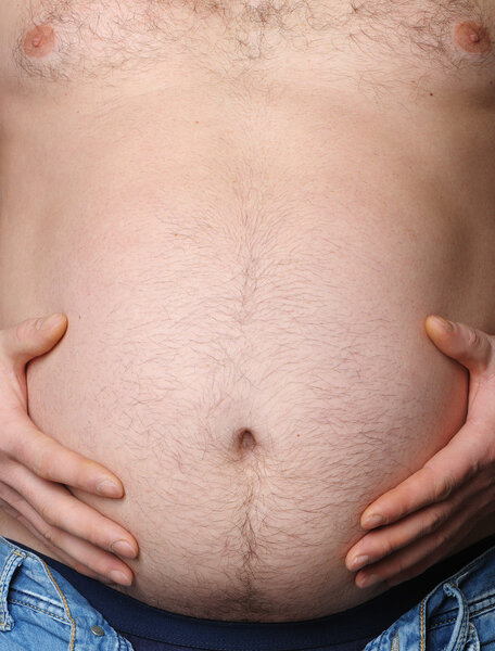 Man's stomach close up. Concept - overweight