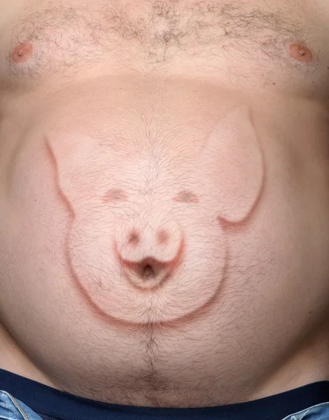 Στομάχι του ανθρώπου από ένα γουρούνι που προεξέχει από την εικόνα — Φωτογραφία Αρχείου