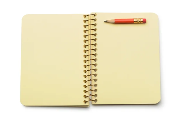 Caderno de papel amarelo e lápis vermelho — Fotografia de Stock