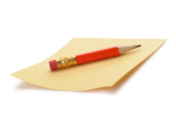 Σημείωση χαρτί και ένα κόκκινο μολύβι — Φωτογραφία Αρχείου