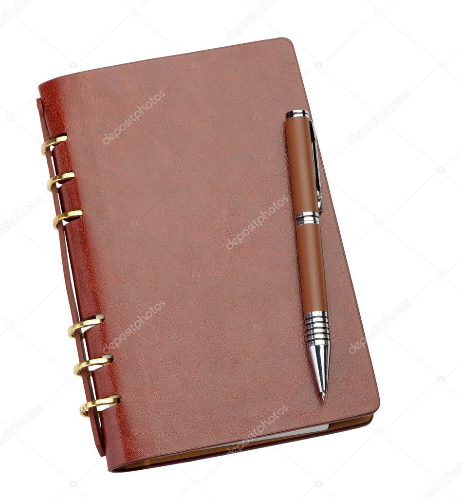 Notebook in a brown leather cover and stylish pen