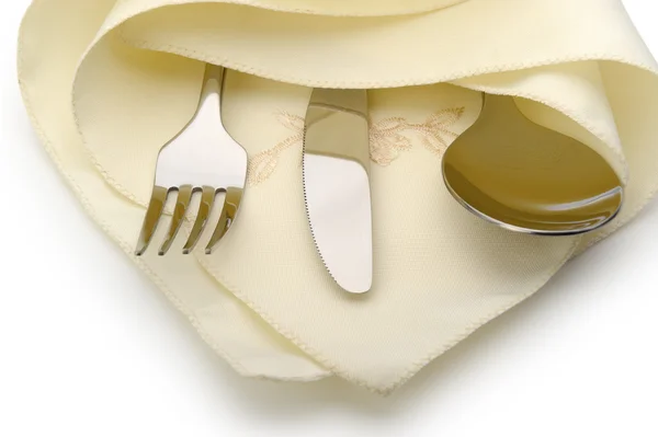Sked, gaffel och kniv ligga på servett — Stockfoto