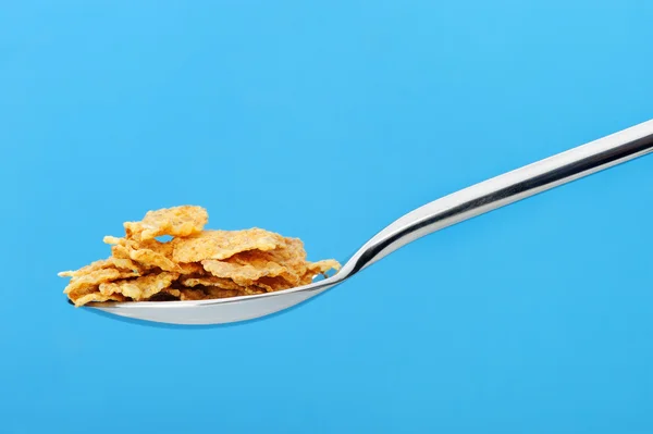 Сornflakes. A dry breakfast in a spoon. — Stock Photo, Image