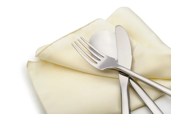 Spoon, fork and a knife lie on serviette — Stock Photo, Image