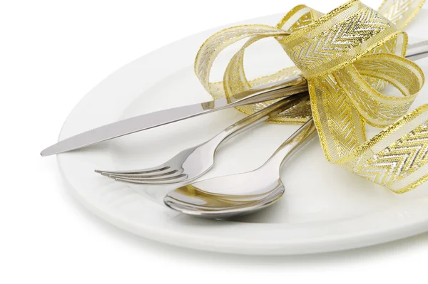 Spoon, fork and a knife tied up celebratory ribbon — Stock Photo, Image