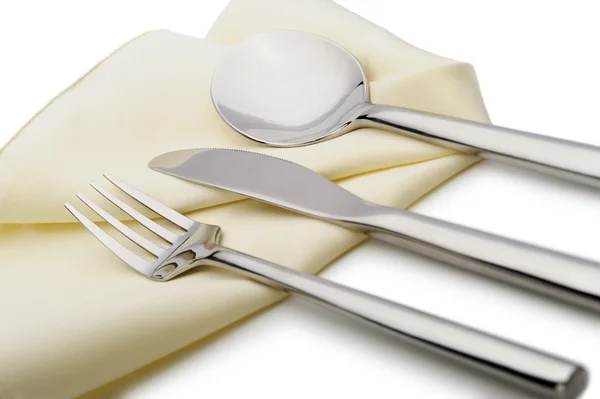 Cuchara, tenedor y un cuchillo yacen en la servilleta — Foto de Stock