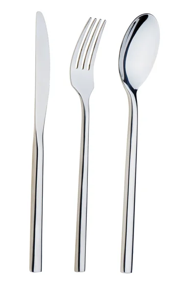 Colher, garfo e uma faca estão em um prato — Fotografia de Stock
