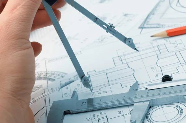 The plan industrial details and a hand with divider — Stock Photo, Image