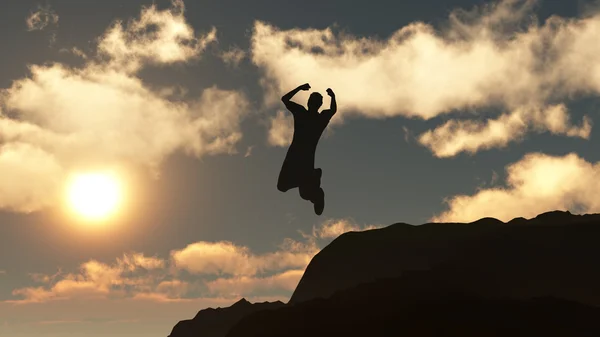 Silhouette des springenden Mannes von einem Felsen — Stockfoto