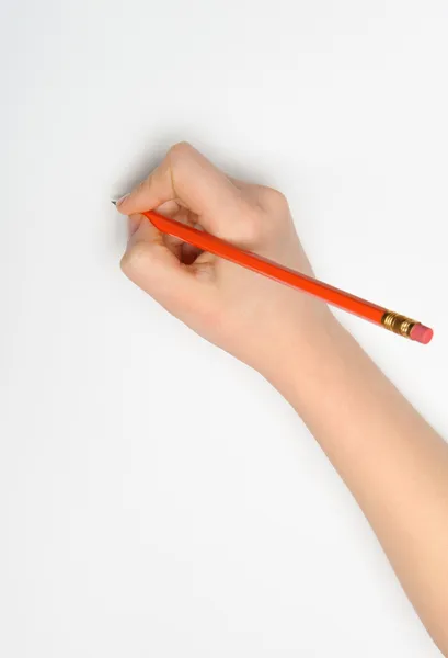 Ręka z czerwonym ołówkiem — Zdjęcie stockowe