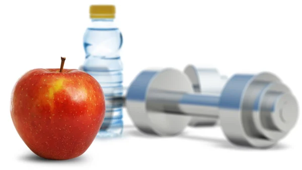 Dumbbells with an apple — Stock Photo, Image