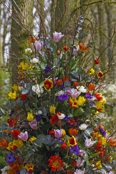 stock image Flower arrangement with tulips and other spring flowers in spring
