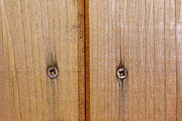 Detail dřevěné dveře s šrouby — Stock fotografie