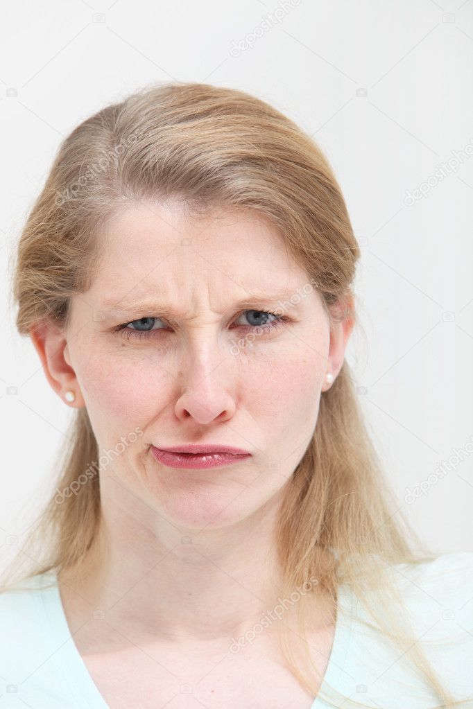 Woman with lopsided quizzical expression