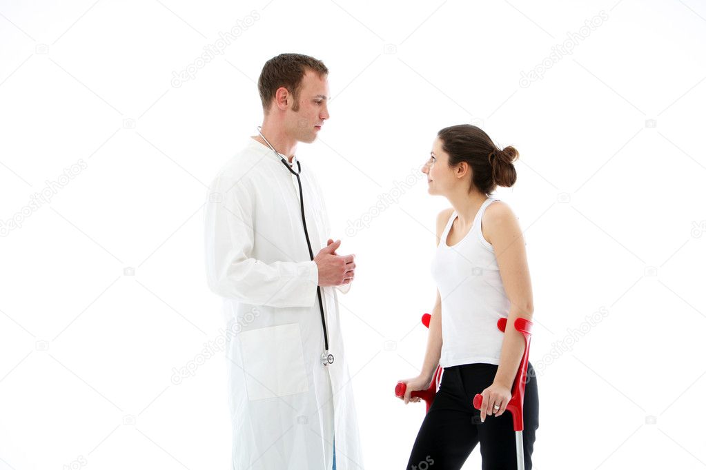 Doctor talking to female patient on crutches