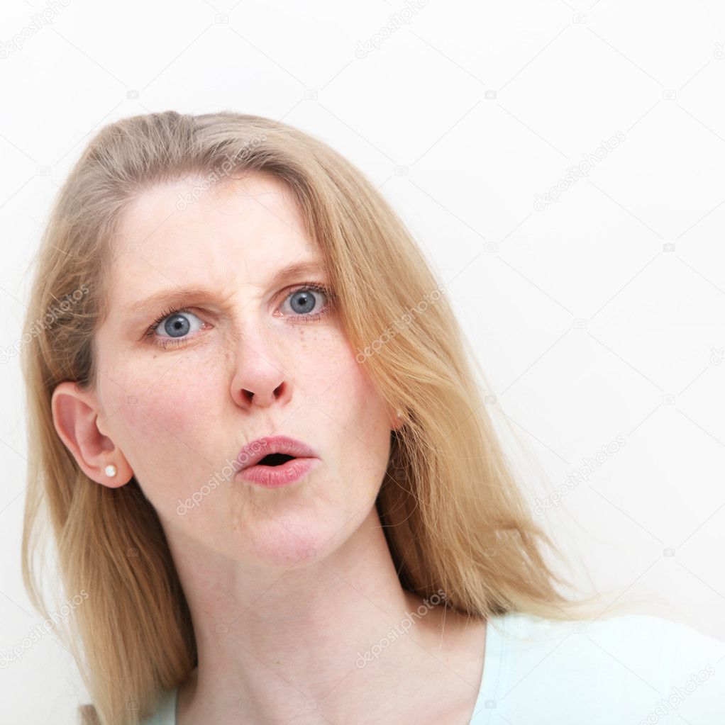 Young woman showing mild shock after hearing news