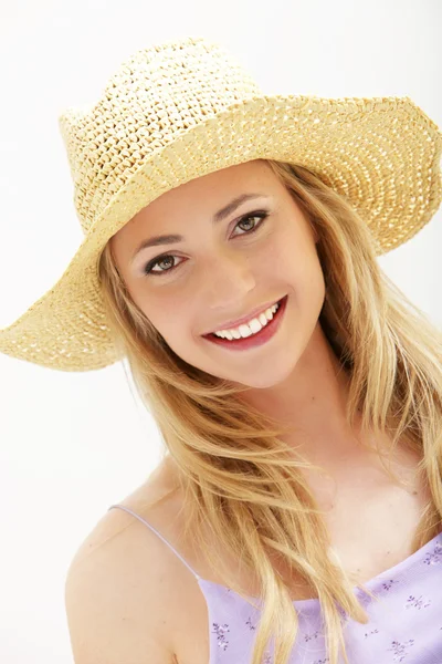 Attractive young woman in straw hat — Stock Photo, Image