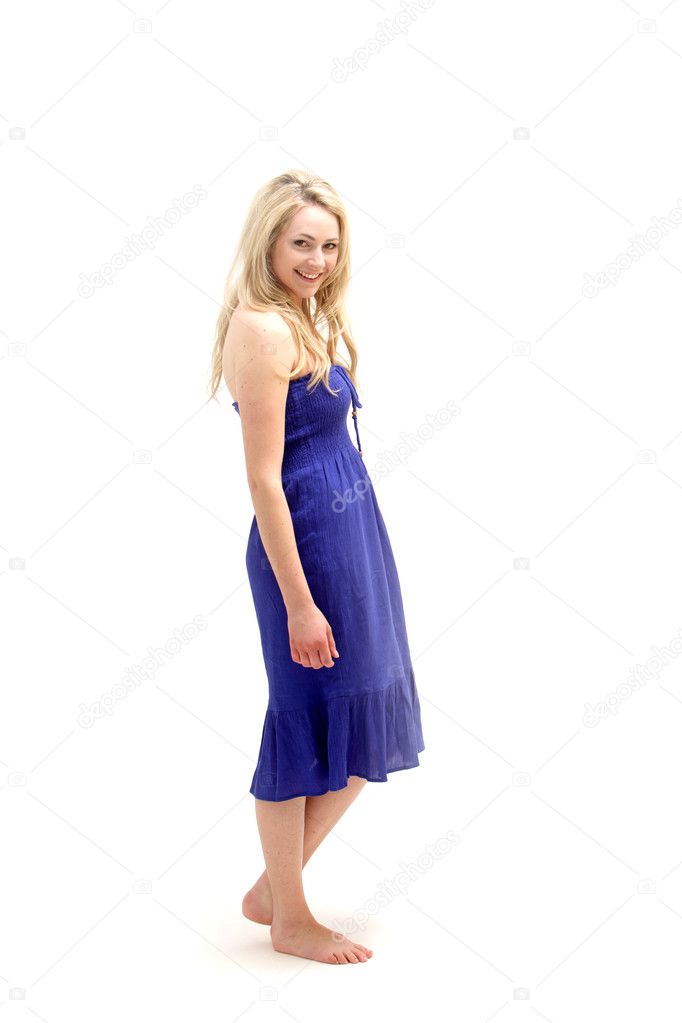 Young barefoot lady in blue dress