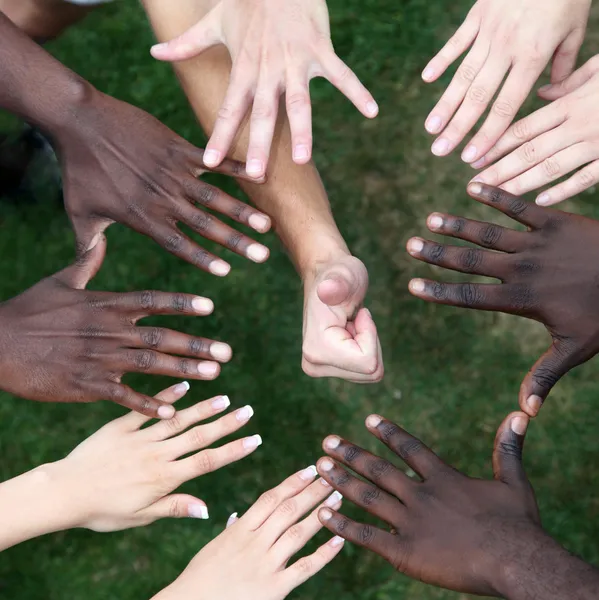 Circle of hands with young from different nations — Stock Photo, Image