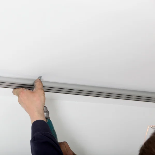 Attaching Metal Track To Ceiling — Stock Photo, Image