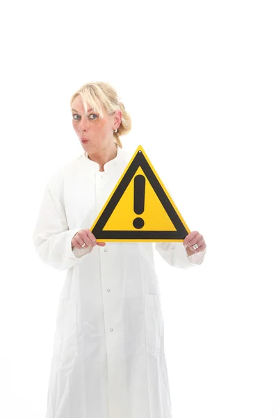Pretty woman with warning sign — Stock Photo, Image