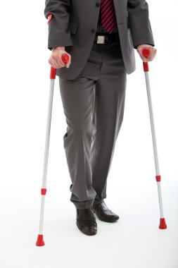 Businessman Walking On Crutches clipart