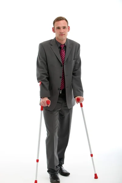 Businessman On Crutches — Stock Photo, Image