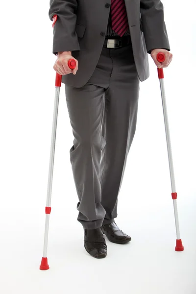 Businessman Walking On Crutches — Stock Photo, Image