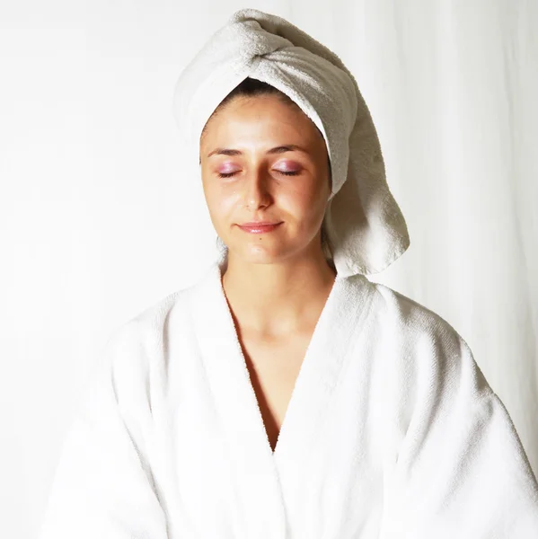 Woman meditating in bathrobe — Stock Photo, Image