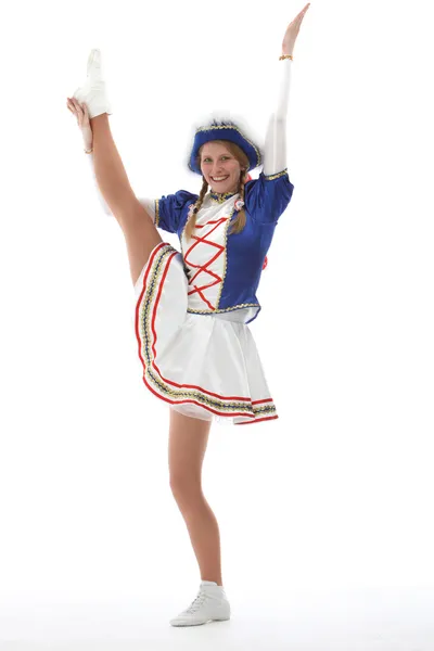 Hübsche, junge Frau im Gardekostüm zeigt gelenkige Tanzpose — Photo