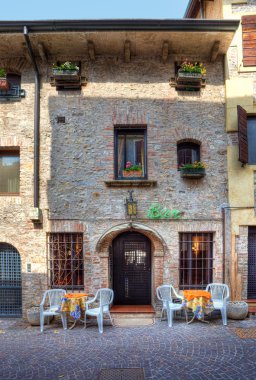 Old house and bar. Sirmione, Italy. clipart