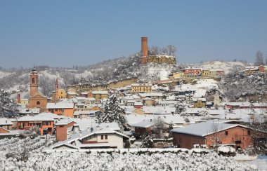 Town covered with snow. Corneliano D'Alba, Italy. clipart