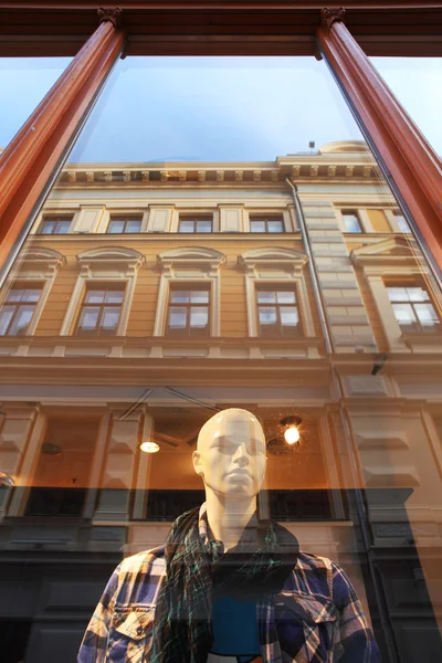 Mannequin behind thw window. Riga, Latvia.